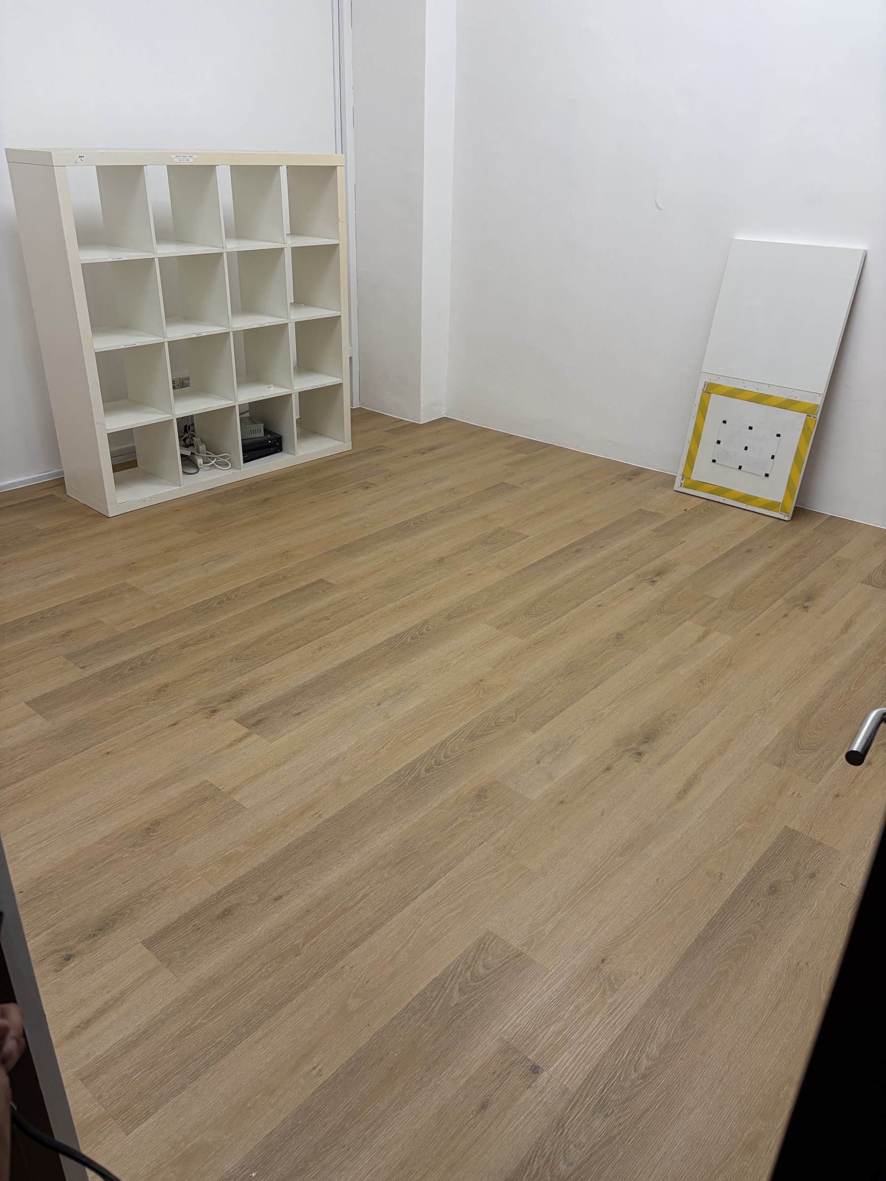 Natural oak wood-look vinyl flooring in a Singapore condo interior